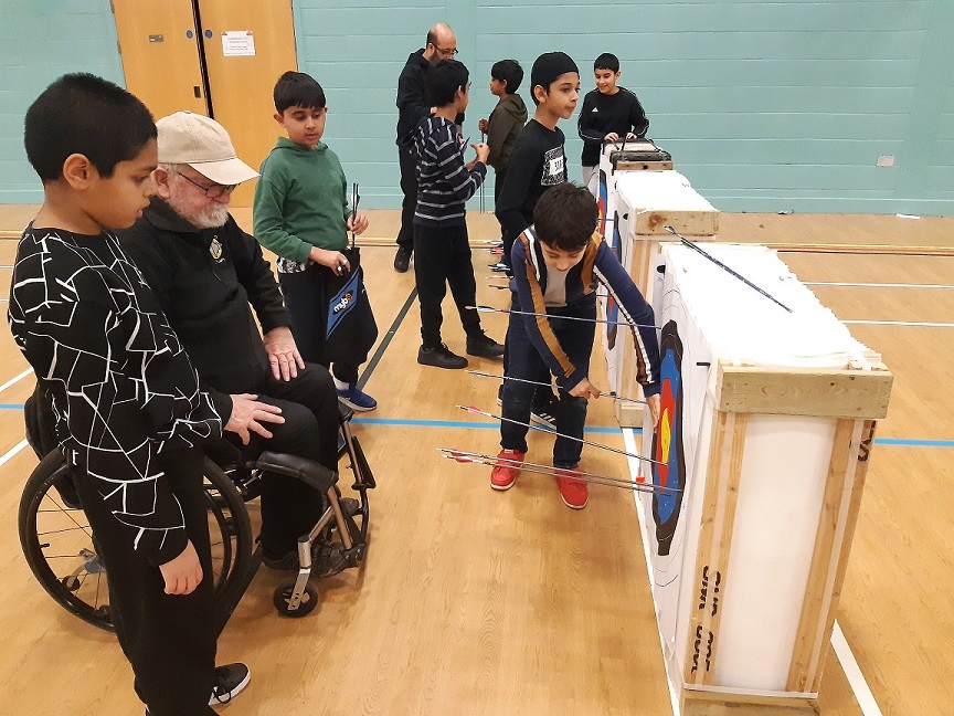 Archers at an indoor competition