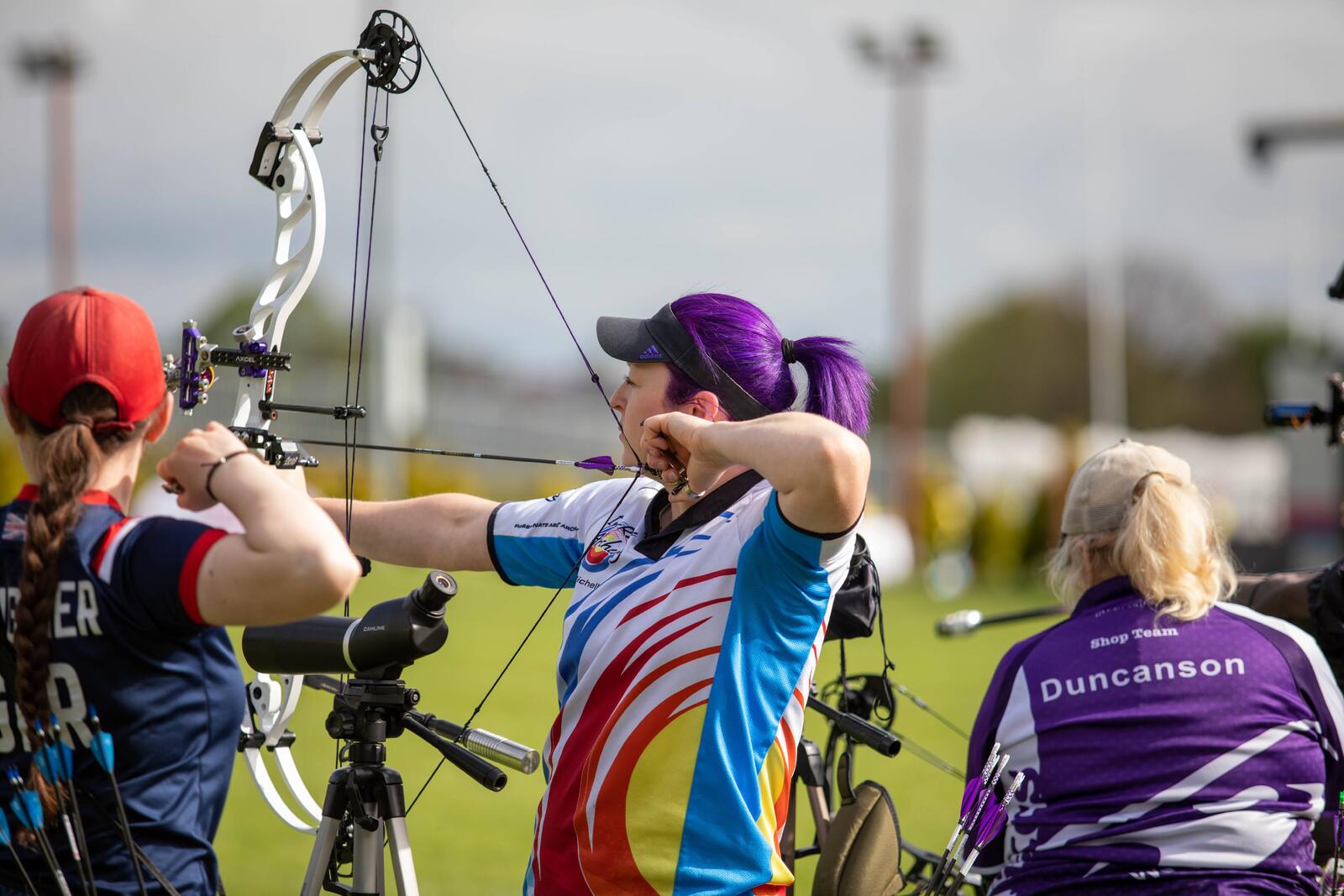 Archers on the shooting line at a competition