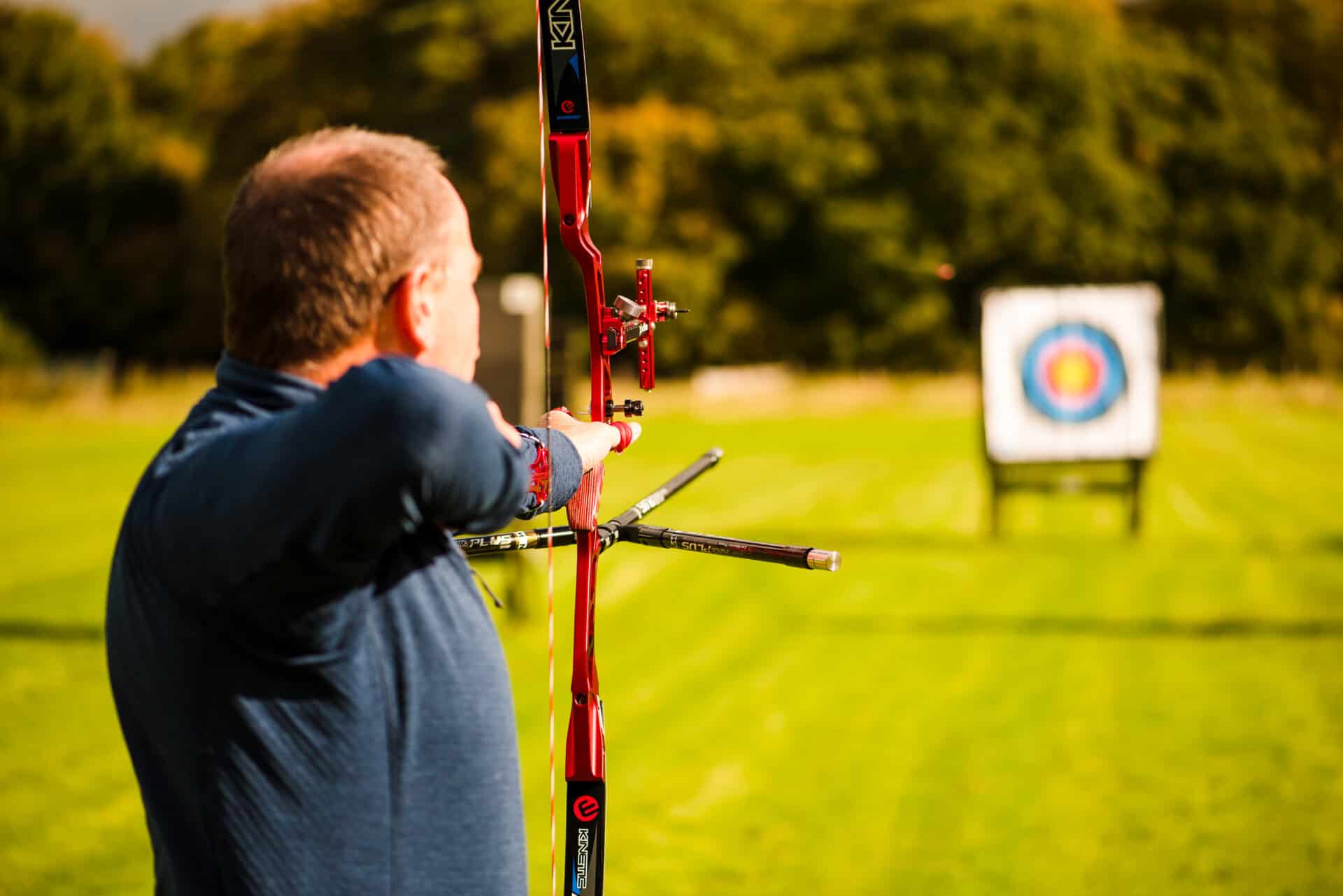 Male archer shooting outdoors